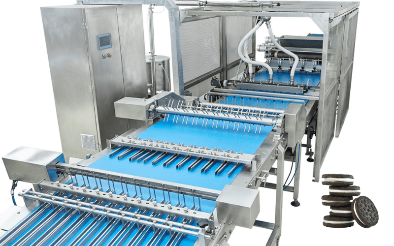 Cookie Capper machine placing top biscuits onto filled bottom biscuits.